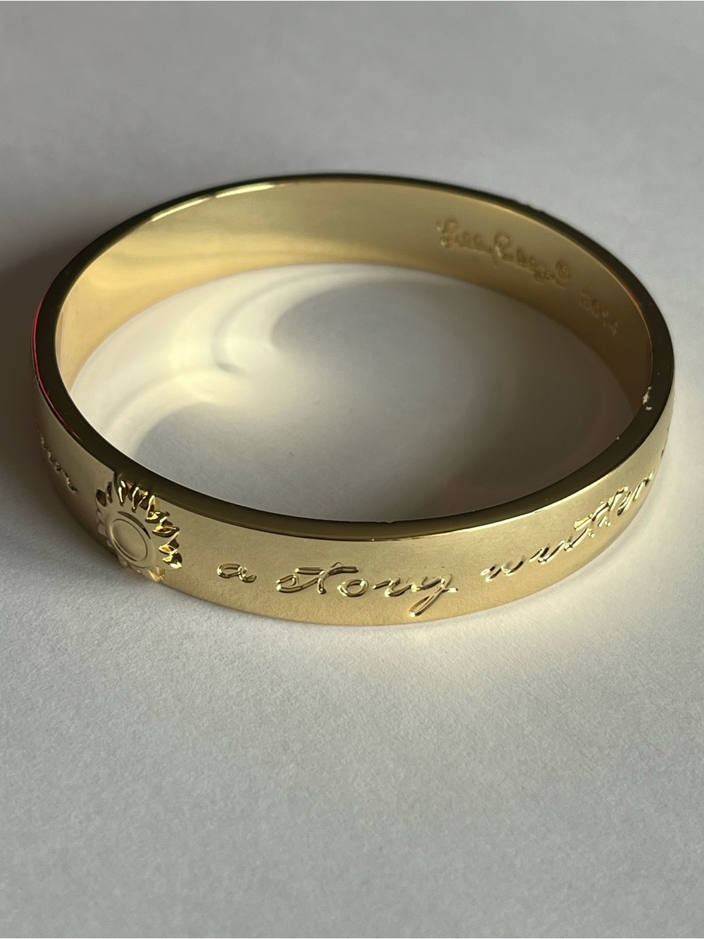 Lilly Pulitzer “A Story Well Told” Gold-Tone Inspirational Bangle Bracelet